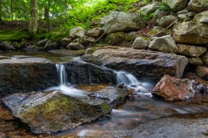 A long exposure photo of a mini waterfall on the Coxing Kill at Mohonk Preserve.