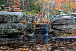 A photo of the waterfall known as Split Rock at Mohonk Preserve in Gardiner, NY on an October morning.