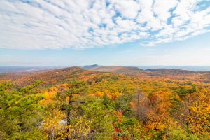 A photo of the autumn landscape in the New Paltz region and surrounding Hudson Valley from one of the lookouts on the Beacon Hill Trail at Minnewaska State Park.
