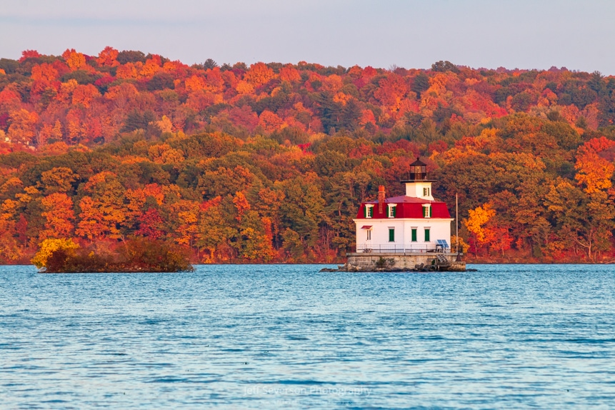 A photo of the Esopus Lighthouse on the Hudson River during the golden hour of an autumn sunset.