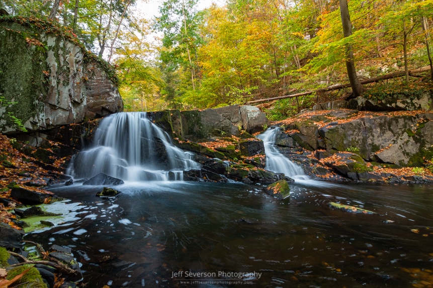 A long exposure photo of a waterfall along Black Creek in Esopus, NY on an October morning.