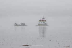 A photo of a fog shrouded Esopus Lighthouse on the Hudson River on a March evening.