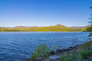 A photo of the Ashokan Reservoir and the surrounding Catskill Mountains on a May morning along the Ashokan Rail Trail.