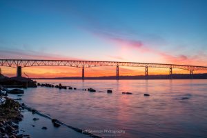 The continuation of a June sunrise over the Hudson River and the Kingston-Rhinecliff Bridge before the solar eclipse.