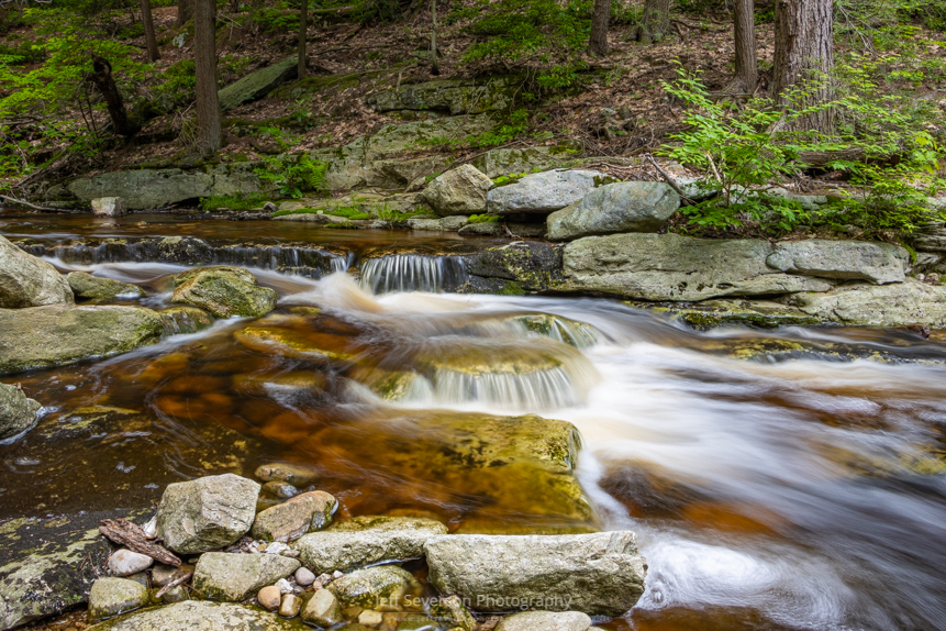 A long exposure photo of mini waterfalls on the Peterskill at Minnewaska State Park Preserve