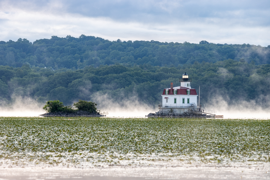 A photo of the Esopus Lighthouse as fog lifts off of the Hudson River on a June morning.