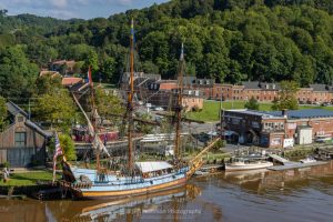 A photo of the Kalmar Nyckel, a replica of 1627 Dutch-built armed merchant ship and Swedish colonial ship, as it sits docked on the Rondout Creek at the Hudson River Maritime Museum.