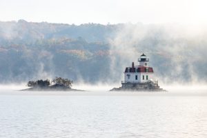 A photo of the Esopus Lighthouse surrouned by fog on the Hudson River on a November morning.