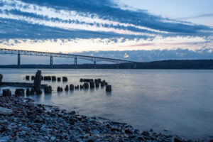 A photo of dawn over the Hudson River from the shoreline of Charles Rider Park in Kingston, NY.