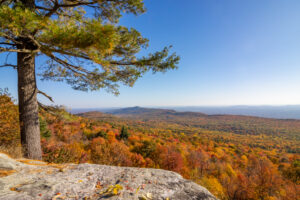 An autumn landscape photograph of the Gardiner region of the Hudson Valley from atop an overlook at Minnewaska State Park Preserve in Kerhonkson on an October morning.
