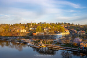 A photo of the Kingston-Rondout District captured from atop the John T. Loughran Bridge during the golden hour after sunrise on an April morning.