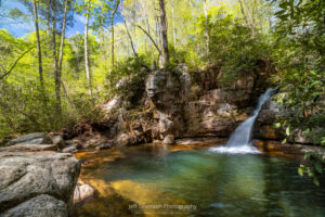 A late morning shot of the third of four cascade waterfalls at a location in TN known as The Blue Hole.