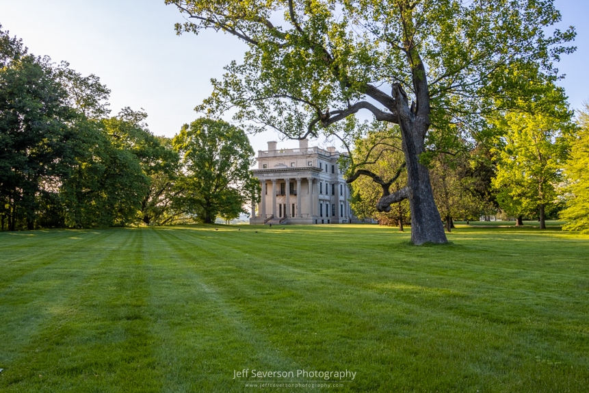 A photo of the lawn and southern side of Vanderbilt Mansion in Hyde Park, NY on a May evening.