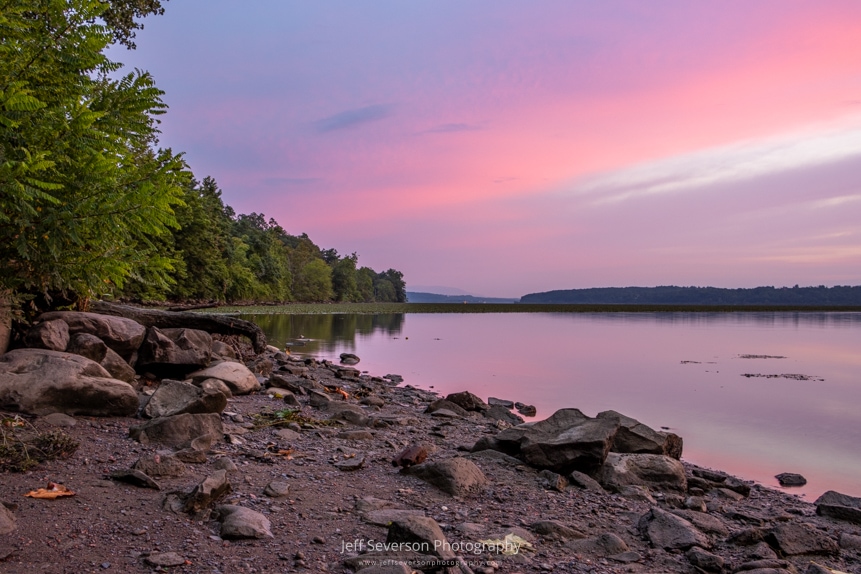 A pink and purple dawn over the Hudson on an August morning from along the shoreline at Lighthouse Park in Ulster Park.