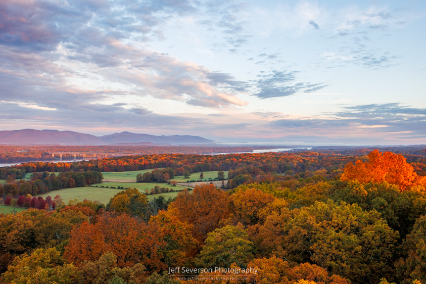 The golden hour of sunrise across Northern Dutchess County from atop the 80 foot tall fire tower at Ferncliff Forest in Rhinebeck, NY on an October morning.