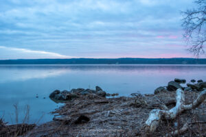 A photo of slightly reddish-pink skies during the first sunrise of February 2024 over the Hudson River.