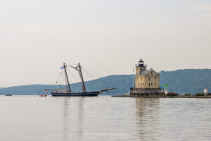The 19th century schooner replica known as Amistad approaching the Rondout Lighthouse as it enters Rondout Creek.