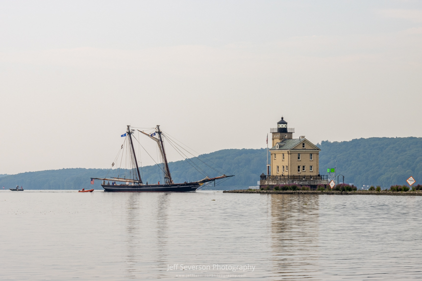 The 19th century schooner replica known as Amistad approaching the Rondout Lighthouse as it enters Rondout Creek.