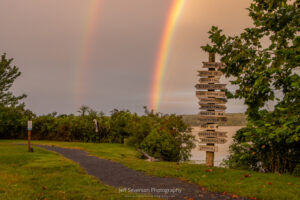 A double rainbow captured over the Hudson River at the mile marker sign at Scenic Hudson's Esopus Meadows Preserve in Ulster Park.