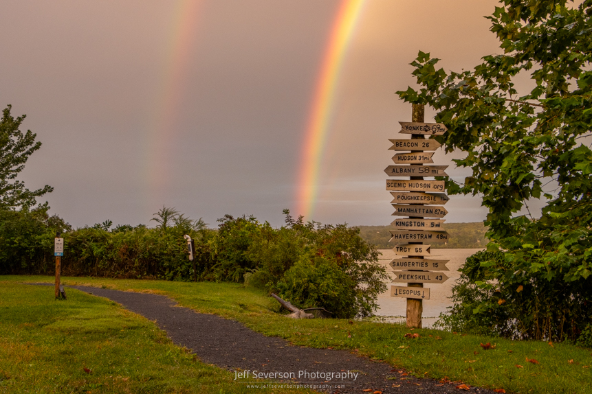 A double rainbow captured over the Hudson River at the mile marker sign at Scenic Hudson's Esopus Meadows Preserve in Ulster Park.