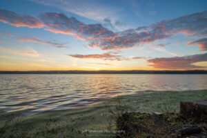 Dawn breaking over the Hudson River during high tide from along the shore of Esopus Meadows Point in Ulster Park.