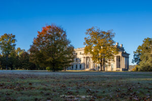 A light frost covering the grounds in front of Vanderbilt Mansion during the golden hour after sunrise on an October morning.