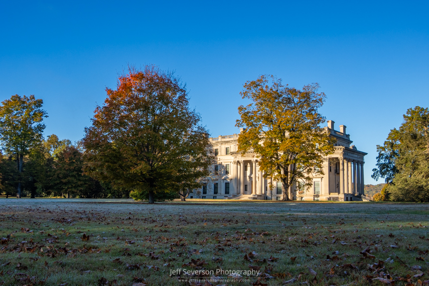 A light frost covering the grounds in front of Vanderbilt Mansion during the golden hour after sunrise on an October morning.