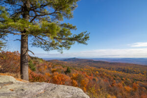 A landscape photo of the Hudson Valley from atop a cliff face at Minnewaska State Park Preserve in Kerhonkson on an October morning.