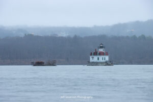 The Esopus Lighthouse at dawn on a foggy first day of Spring shot from the shoreline of Lighthouse Park in Ulster Park, NY.