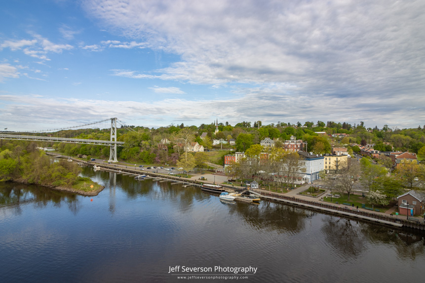 A landscape photo of the Kingston Rondout waterfront district on a May morning as seen from atop the John T. Loughran Bridge that spans over the Rondout Creek.